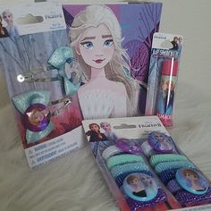 the contents of a frozen princess gift set including hairbrushes, toothpaste and other items