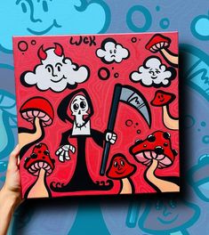 a person holding up a painting on a wall with mushrooms and clouds in the background