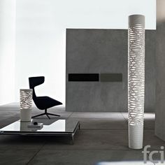 a chair and table in a room with concrete walls