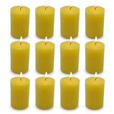 twelve yellow candles are lined up in rows