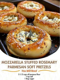 there are several bagels that have been cooked in the oven and topped with cheese