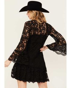 Channel your inner Stevie Nicks with this black lace dress with flare sleeves. The splender of this beautifully designed cotton blend lace dress can't be denied. It is a two piece dress with a separate lining. The inspiring sleeves flare out and have scalloped edges as well as the hemline. Import. Machine wash cold with like colors only. Non-chlorine bleach when needed line dry warm iron if needed. Perfect lace dress for any cowgirl. Perfect for the rodeo, trip to Nashville or a country music co Bell Sleeve Mini Dress, Black Bell Sleeve Dress, Flare Sleeves, Lace Crochet, Black Lace Dress, Bell Sleeve Dress, Lace Mini Dress, Two Piece Dress, Women Lace