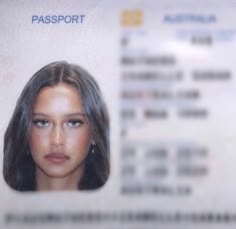 a woman's face is shown on a passport card