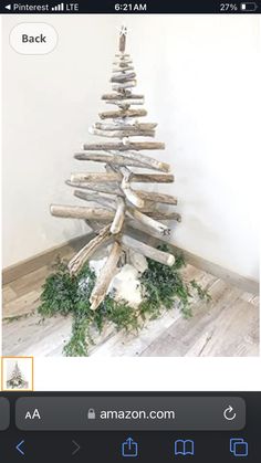 a christmas tree made out of driftwood is displayed on an instagram page with the caption