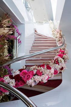 the flowers are on the stair railing and there is no image here to provide a caption for