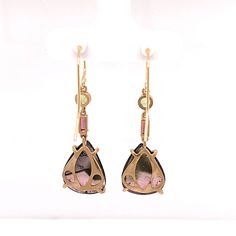 Paris is beautiful this time of year. So are you. These one-of-a-kind liddicoatite tourmaline earrings are perfect for your day of adventure. Un café, s'il vous plaît! The back of the design is just as lovely as the stone it was crafted to accentuate. Walking down narrow, cobbled streets never looked so good. The world is your runway, so strut your stuff! Details: One-of-a-kind Liddicoatite tourmaline from Madagascar (15x12mm), peridot (3mm), pink tourmaline (4x2mm), 14k Gold. Total length (35.7 Liddicoatite Tourmaline, Cobbled Streets, Peridot Earrings, Tourmaline Earrings, Pink Tourmaline, Stone Settings, Madagascar, Earrings Handmade, Tourmaline