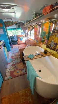 the interior of an rv with colorful decor