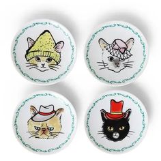 four plates with cats wearing hats on them