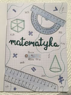 a notebook with the words matentaykka written on it, and a ruler next to it