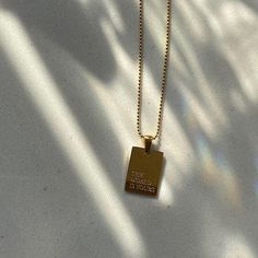 Gold dog tag necklace with "The World Is Yours" engraved on it. Necklace Quotes, Engraved Pendant, Tarnished Jewelry, Square Pendant, Engraved Jewelry, Engraved Necklace, Steel Necklace, Love Necklace, Gold Plated Necklace