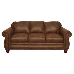 a brown leather couch sitting on top of a white floor