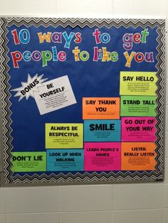 a bulletin board with words written on it in different colors and phrases, along with an image of someone's smile