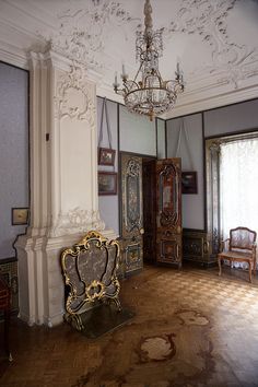 an ornately decorated room with antique furniture