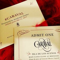 two cards that say admit one caraval