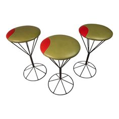 three tables with red circles on them sitting in front of each other's legs