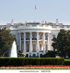 the white house with fountain in front of it