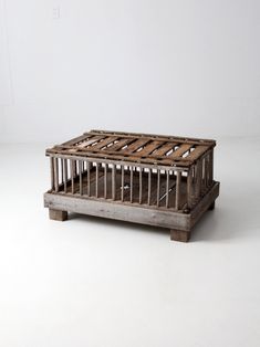 an old wooden crate sitting on top of a white floor