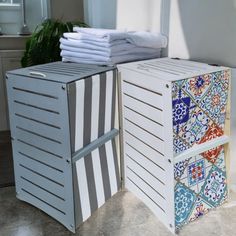 a stack of folded towels sitting on top of a cabinet