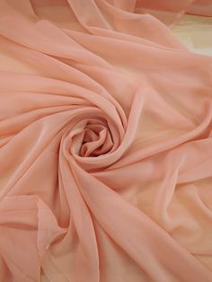 Samples are available, read below.  Peach two-tone chiffon fabric.  Chiffon is a sheer and lightweight fabric. The fabric is soft and drapes well.  When the fabric is gathered the color looks darker vs. when the fabric lays flat. Content: 100% Polyester Width: 58/59 inches wide Weight: Lightweight Sold by whole yards.  One yard is 36 inches ( 3 feet). If you purchase more than one yard it will be sent in one continuous piece if possible. The video shown is of a pink color chiffon.  Colors may vary due to lighting. **Fabric may come with natural flaws.** **Fabric may not be cut perfectly straight.** **Fabric may be wrinkled.** The fabric might have natural flaws like crease marks and/ or be wrinkled. Fabric is folded when shipped, therefore folding might create creases in the fabric. When r Retro Witch, Lighting Fabric, Wrinkled Fabric, Light Pink Fabric, Light Peach Color, Peach Fabric, Colour Theory, Soft Coral, Light Peach