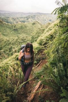 a woman hiking up a steep hill in the jungle with text overlay that reads 1 kuluu ridge trail