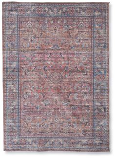 an antique rug with pink and blue colors