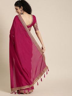 Magenta pink solid saree and has a zari borderThe model is wearing a stitched version of the blouse piece. The saree comes with an unstitched blouse piece. Pink Georgette Pre-draped Saree With Embroidered Border, Traditional Pink Pre-draped Saree With Embroidered Border, Semi-stitched Traditional Wear With Border For Eid, Diwali Dola Silk Pre-draped Saree With Border, Semi-stitched Bollywood Blouse Piece With Embroidered Border, Pre-draped Saree With Embroidered Border For Eid Puja, Bollywood Pre-draped Saree With Embroidered Border, Unstitched Choli With Embroidered Border For Diwali, Bollywood Style Traditional Wear With Embroidered Border