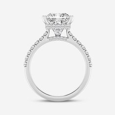 a white gold engagement ring with diamonds on the sides