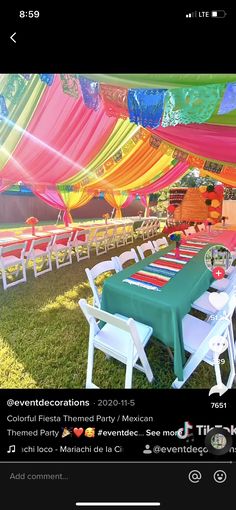 an outdoor event with tables and chairs set up under colorful tented party decorations for mexican themed events