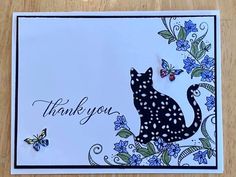 a thank card with a cat and butterflies on it