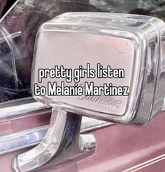 a car door handle with the words pretty girls listen to melane martinz on it