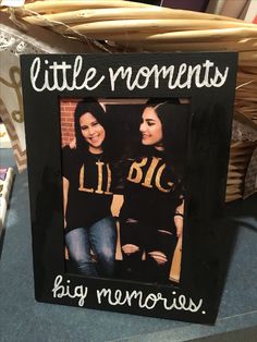 two girls in black shirts with the words little moments on them