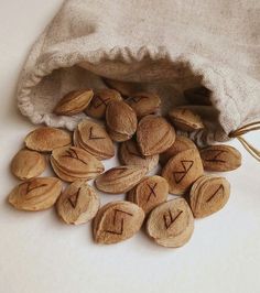 almonds with the letters x and y on them are spilling out of a bag