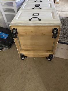 a large wooden box sitting on top of a floor