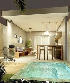 an indoor swimming pool in the middle of a living room