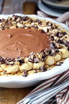 a chocolate and banana pie on a wooden table