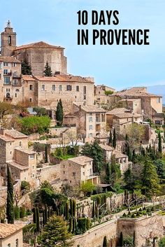 an old village with trees and bushes on the hillside in front of it is text overlay that reads 10 days in provence