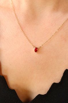 Elevate your style with this exquisite 14K gold necklace featuring a captivating red gemstone pendant. The deep, rich hue of the ruby exudes timeless beauty, making it a perfect accessory for various occasions. Handcrafted with precision, this chic and stylish necklace adds a touch of sophistication to any ensemble. Whether you're attending a special event or simply want to enhance your everyday look, this red stone jewelry is a symbol of classic charm and enduring elegance. Key Features: Material: 14K Gold Dazzling ruby gemstone pendant Handcrafted for a unique touch Classic and timeless design Perfect for any occasion Red Birthstone Necklace In Fine Jewelry Style, Fine Jewelry Red Birthstone Necklace, Ruby Birthstone Necklaces, Formal Red Gemstone Birthstone Necklace, Red Oval Necklace For Anniversary, Classic Red Birthstone Necklace As Gift, Fine Jewelry Red Gemstone Birthstone Necklace, Red Round Pendant Birthstone Necklace For Formal Occasions, Red Gemstone Birthstone Necklace Fine Jewelry