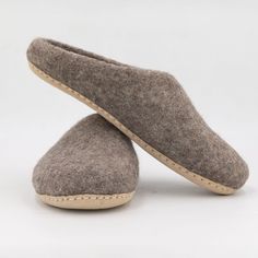 Natural wool slippers with a comfortable arch and a flexible sole. These shoes are handcrafted using a 100% wool felt technique and include a thick suede sole that is flexibly movable according to your footsteps and provides support to the base of your feet.  Boiled wool-felted slippers are intended for those who prefer a firmer slipper that is easy to put on and take off on any type of floor. Felt slippers are extremely soft, warm, and cozy, as well as moisture-wicking, which are key properties of organic wool. True to size without compromising commitment to all-natural fashion and perfectly fit to your feet. ☆ FEATURES: ➾ Colors: #43 - Refer to the color chart of the listing ➾ 100% Pure wool with Azo-free dyes. ➾ Handmade with love by Nepali Artisans. ➾ Fair Traded and Sustainable Produc