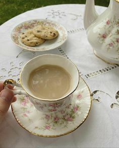 a cup of tea and cookies on a table