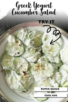 a bowl filled with cucumber salad on top of a table