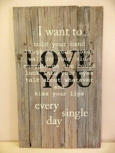 a wooden sign that says i want to hold your hand