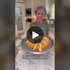 an older woman holding a tray with food on it