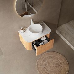 a bathroom with a sink, mirror and rug on the floor in front of it