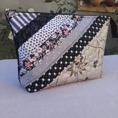 a close up of a purse on a table