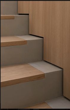 some wooden steps leading up and down to the top floor in a home or office