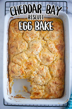 an egg bake in a white dish with the words cheddar bay biscuit