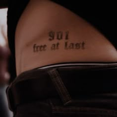 the back of a woman's stomach with an inscription on it that reads 901 true at last