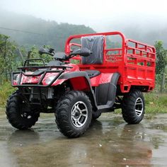 a red four wheeler parked in the rain