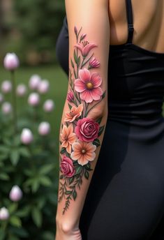 a woman's arm with flowers on it