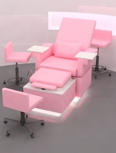 a pink chair with two stools and a table